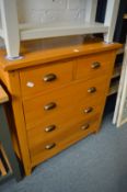 A modern oak chest of drawers.