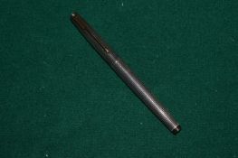 A gold nibbed fountain pen.