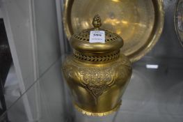 An Islamic gilded metal censer and cover.