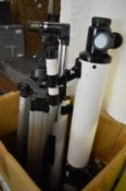 Two telescopes with tripod stands.