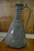 An Eastern copper ewer.