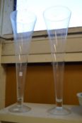 A large pair of glass trumpet shaped vases.