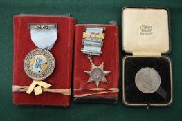 Three decorative medals.
