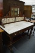 A Victorian walnut, mahogany and tile backed washstand.