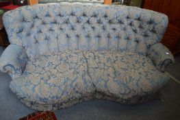 A button upholstered settee.