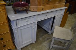 A grey painted pedestal desk.