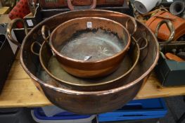 Three copper preserve pans.