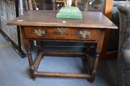 An 18th century oak side table.