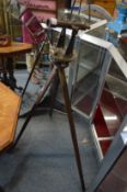 An early brass surveyors scope with tripod stand.
