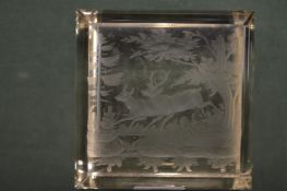 A glass paperweight engraved with a stag and doe.