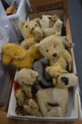 Quantity of well loved teddy bears and other items.