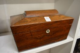 A Victorian rosewood sarcophagus shaped tea caddy.