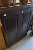 An oak two door cupboard.