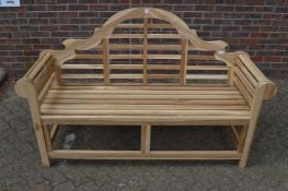 A modern Lutyens style hardwood garden bench.