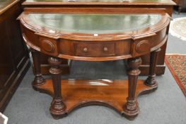 A 19th century mahogany demi-lune table with green leather inset top.