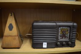 A Bakelite radio and a metronome.