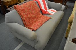 A Loaf large grey upholstered settee with matching footstool.