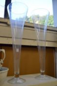 A large pair of glass trumpet shaped vases.