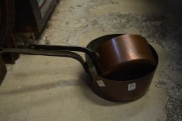 Two copper pans.