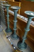 Three green painted wooden jardiniere stands.