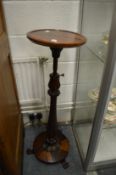 A 19th century rosewood adjustable jardiniere stand.