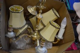 Brass five branch chandelier with shades.