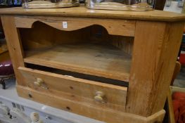 A pine corner TV unit.