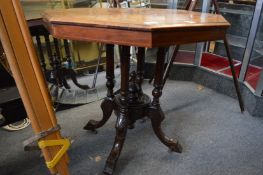 An Edwardian inlaid walnut octagonal shaped occasional table.
