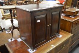 A small oak cupboard.