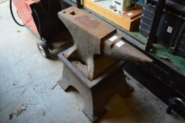 A cast iron anvil with stand.