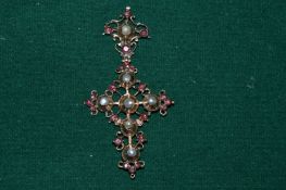 A yellow metal, pearl and gem set crucifix pendant.