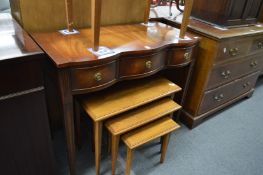 Reproduction mahogany serpentine fronted three drawer side table.