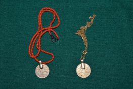 Coral necklace with coin style pendant.