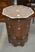 An Eastern bone inlaid carved octagonal shaped occasional table.