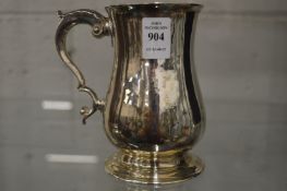 A Georgian silver tankard.