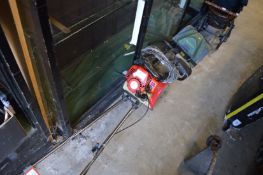 A petrol garden tiller and an electric tiller.