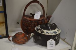 Three Chinese yixing teapots.