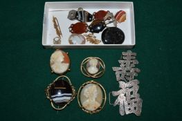 A gold bar brooch, various cameos etc.