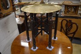 An Eastern engraved brass tray table.