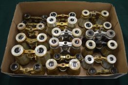 A collection of mother of pearl opera glasses.