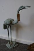 A pair of verdigris patinated models of storks.