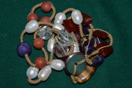 Decorative pearl and jade and other hard stone necklace.
