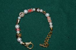 A decorative bracelet signed Joolz.