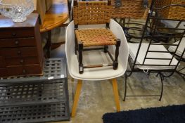 A storage rack and two chairs.