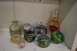 A collection of glass paperweights.