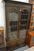 An oak four door cupboard bookcase.