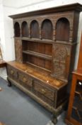 A 19th century Continental oak dresser with carved decoration.
