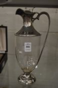 A silver mounted Goldsmiths and Silversmiths company plain glass claret jug.