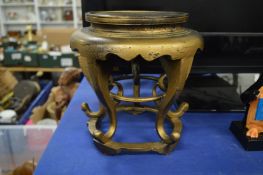 A Chinese gold painted lacquer stand.