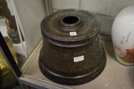 A large Islamic engraved brass torch base.